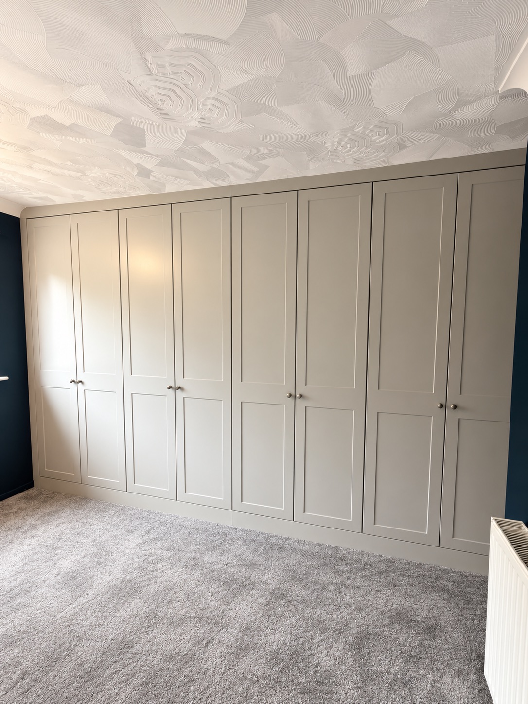 Light grey Rockingham shaker fitted wardrobes with four double wardrobe sections in Wakes Colne Essex
