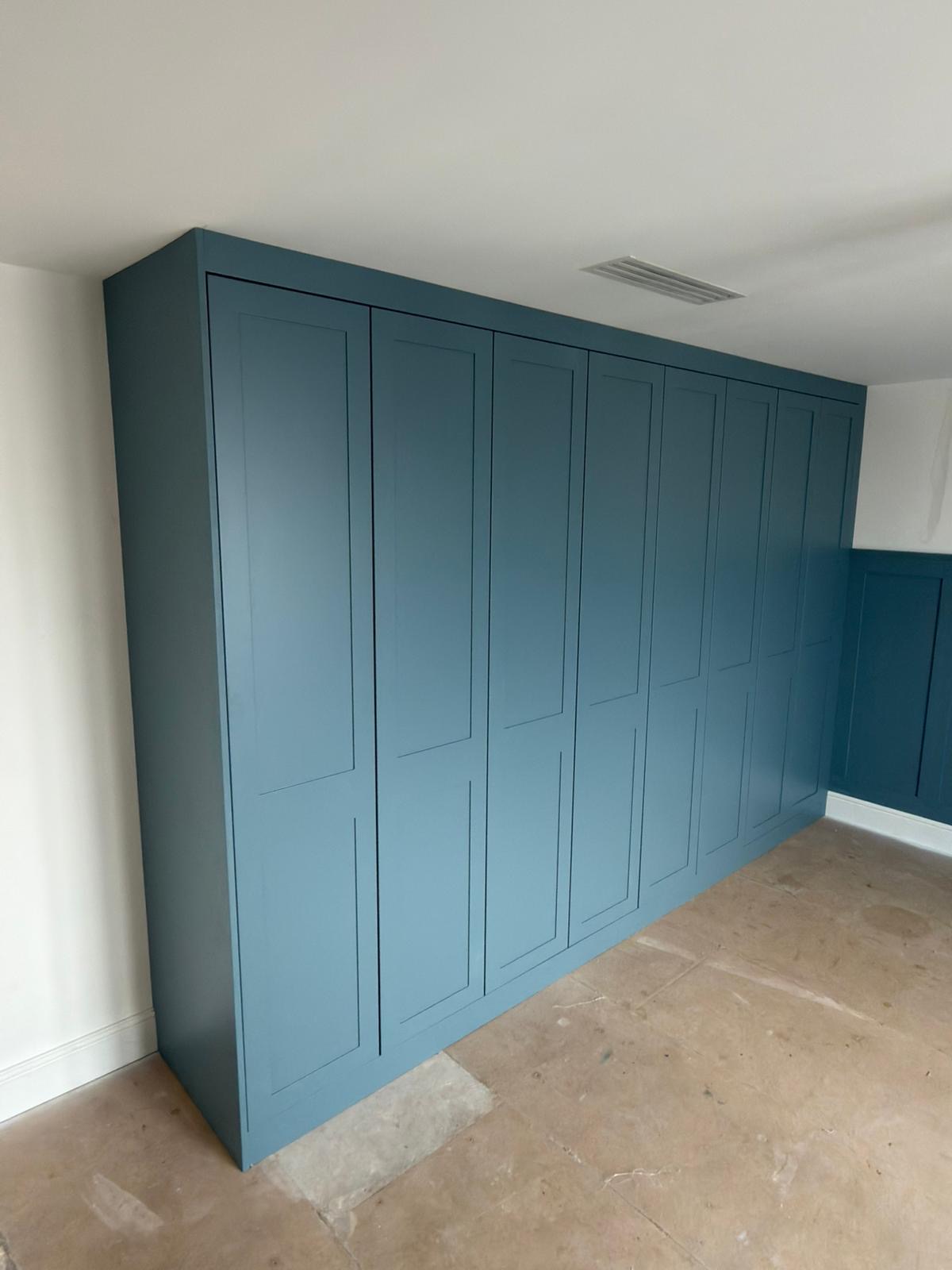 Painted Goodwood bespoke fitted wardrobes with multi-panel door detailing