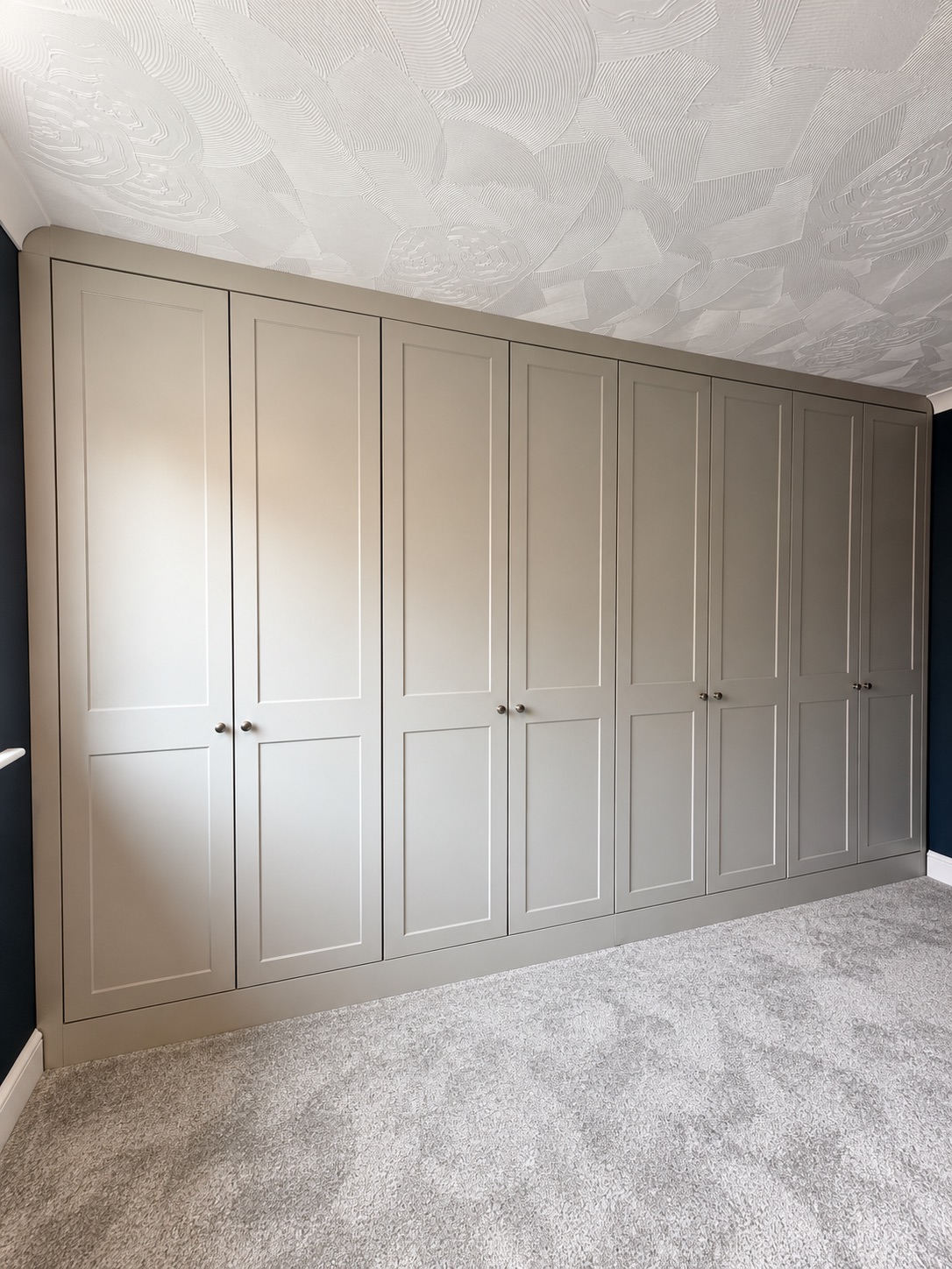 Light grey Rockingham shaker wardrobes from the completed Wakes Colne project