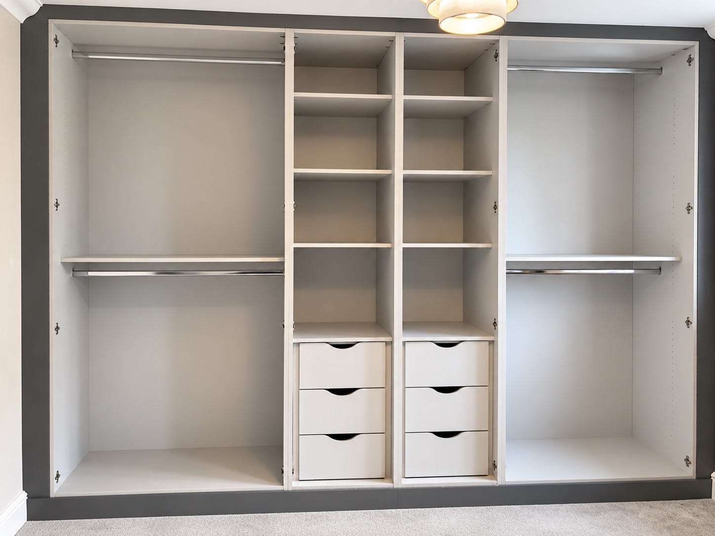 Bespoke fitted wardrobes in Ipswich with a matt Onyx finish and concealed interior storage