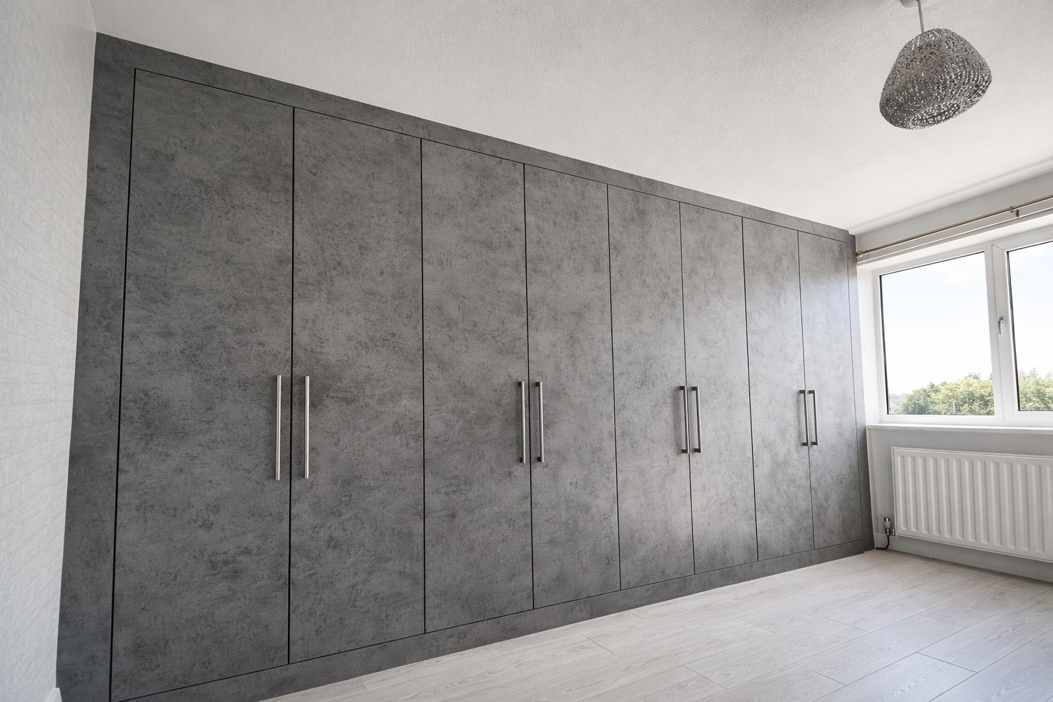 Concrete fitted wardrobe design and project example in Romford by Simply Fitted Wardrobes