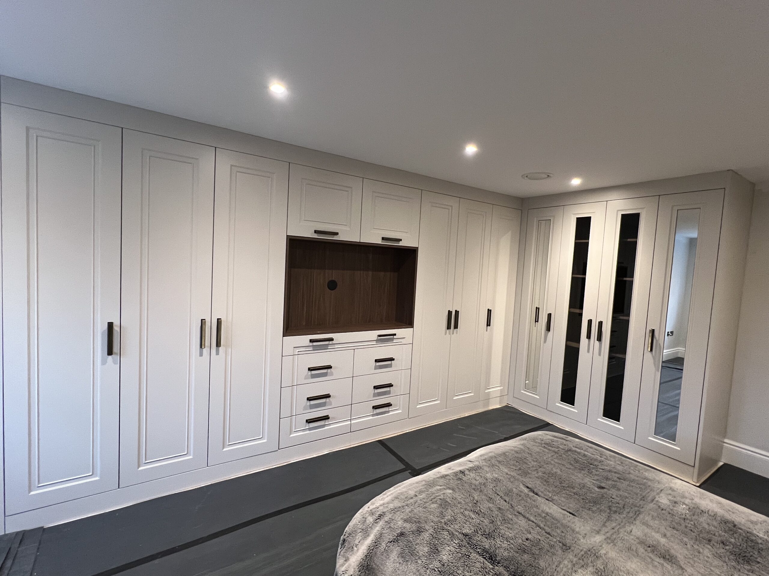 Goodwood bespoke fitted bedroom furniture with integrated media and storage design
