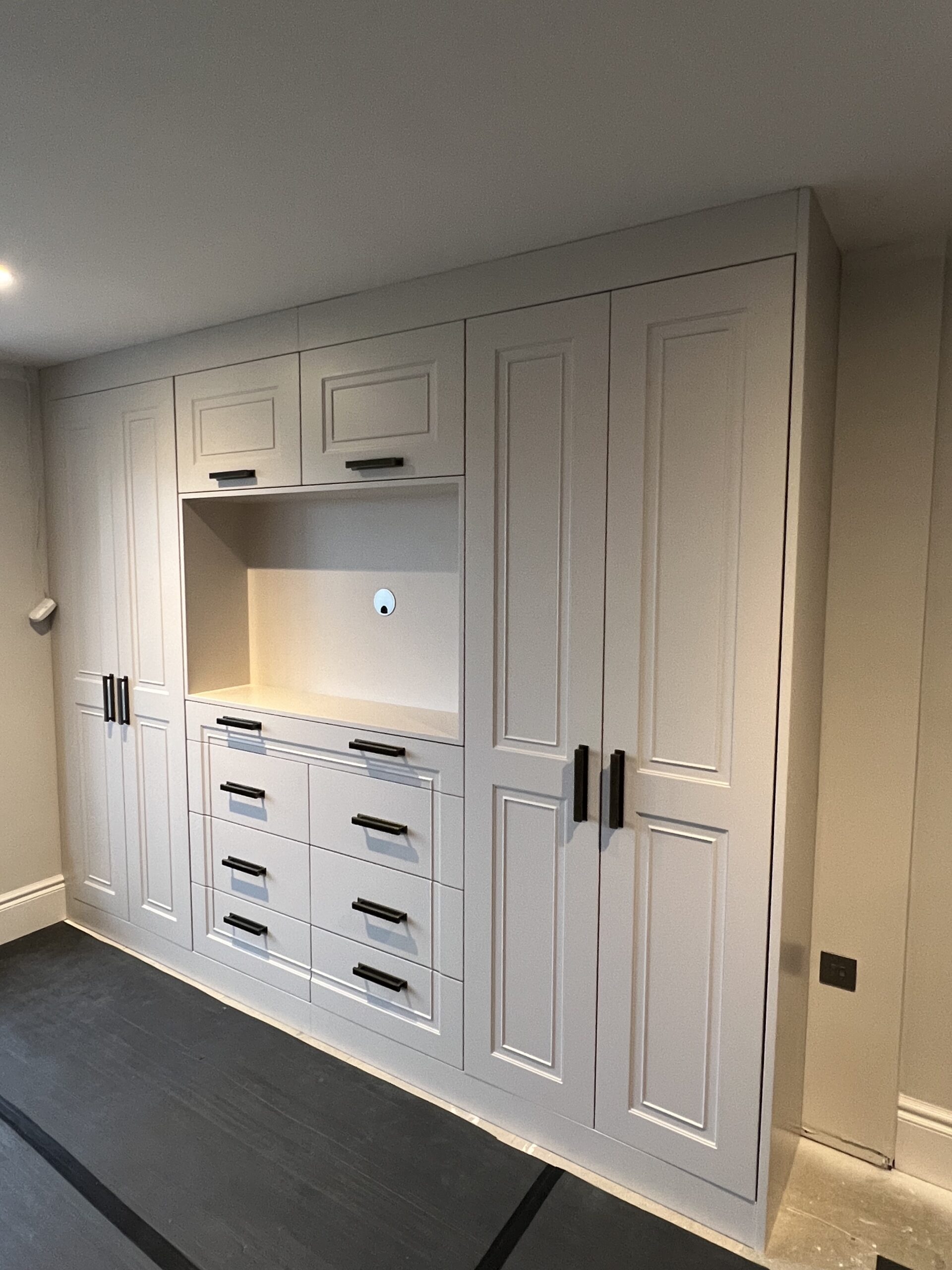 Goodwood bespoke wardrobes with integrated dressing area and drawer furniture