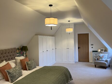 Elegant corner wardrobe with Farrow and Ball All White finish, designed for optimal storage and style.