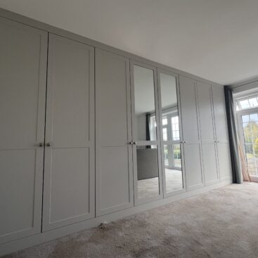 Dove grey Rockingham Range wardrobe enhancing a bright Essex bedroom.