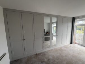 Rockingham Range wardrobe in Essex featuring dove grey finish and inset mirrors.