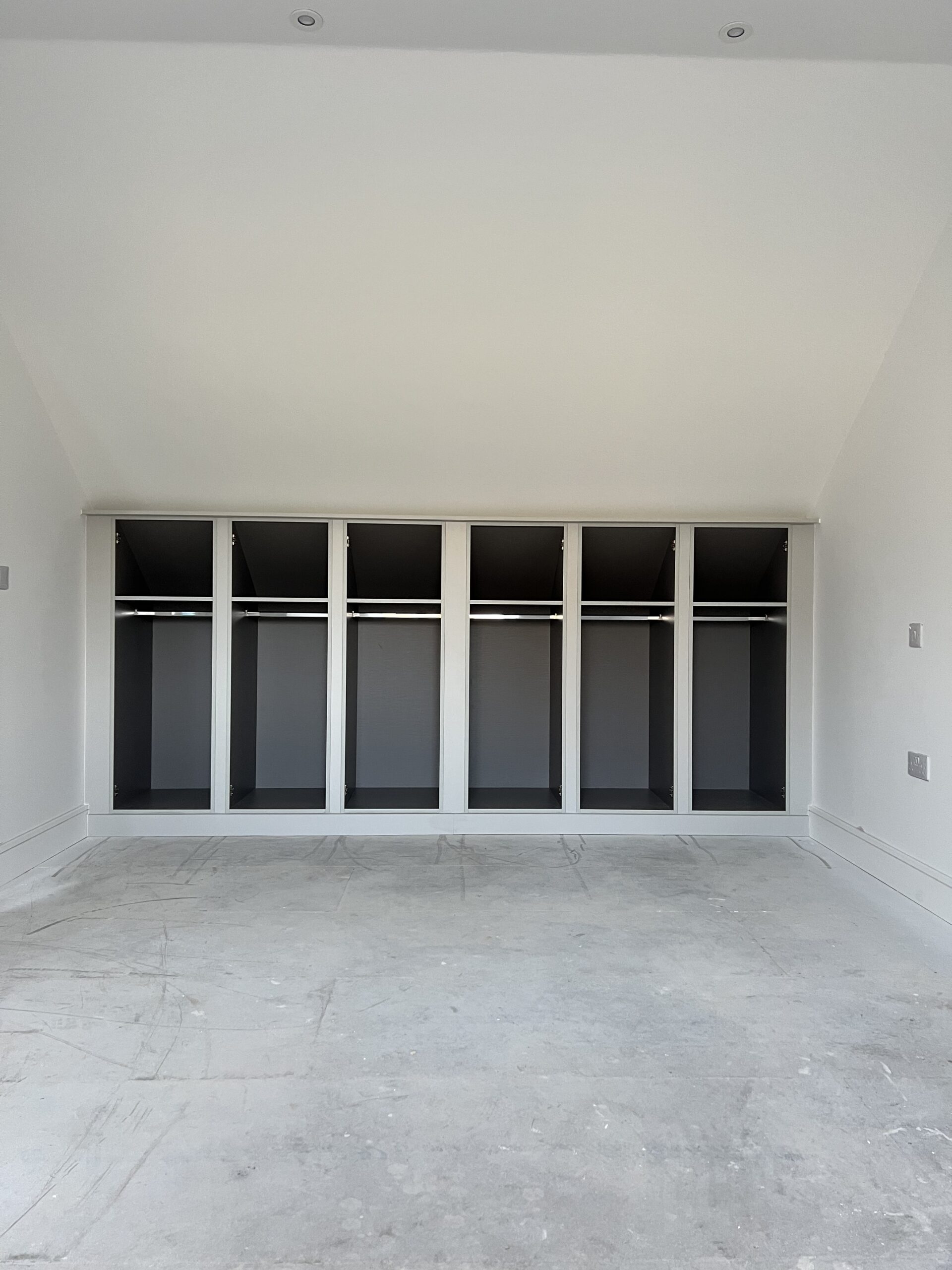 Bespoke fitted loft wardrobes installed by Simply Fitted Wardrobes in a loft conversion