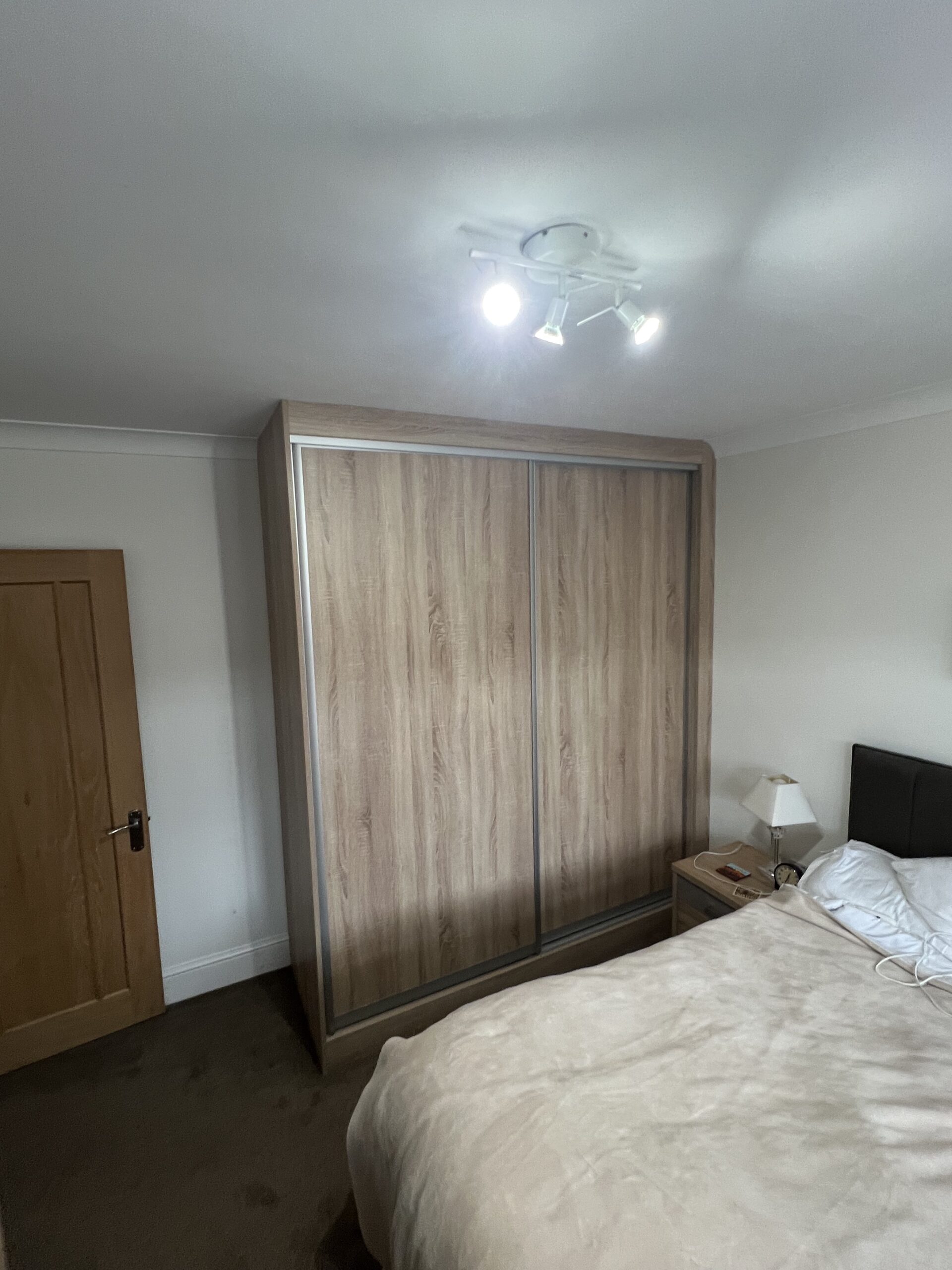 Natural oak sliding wardrobe ideas and sliding wardrobe project in Brentwood Essex