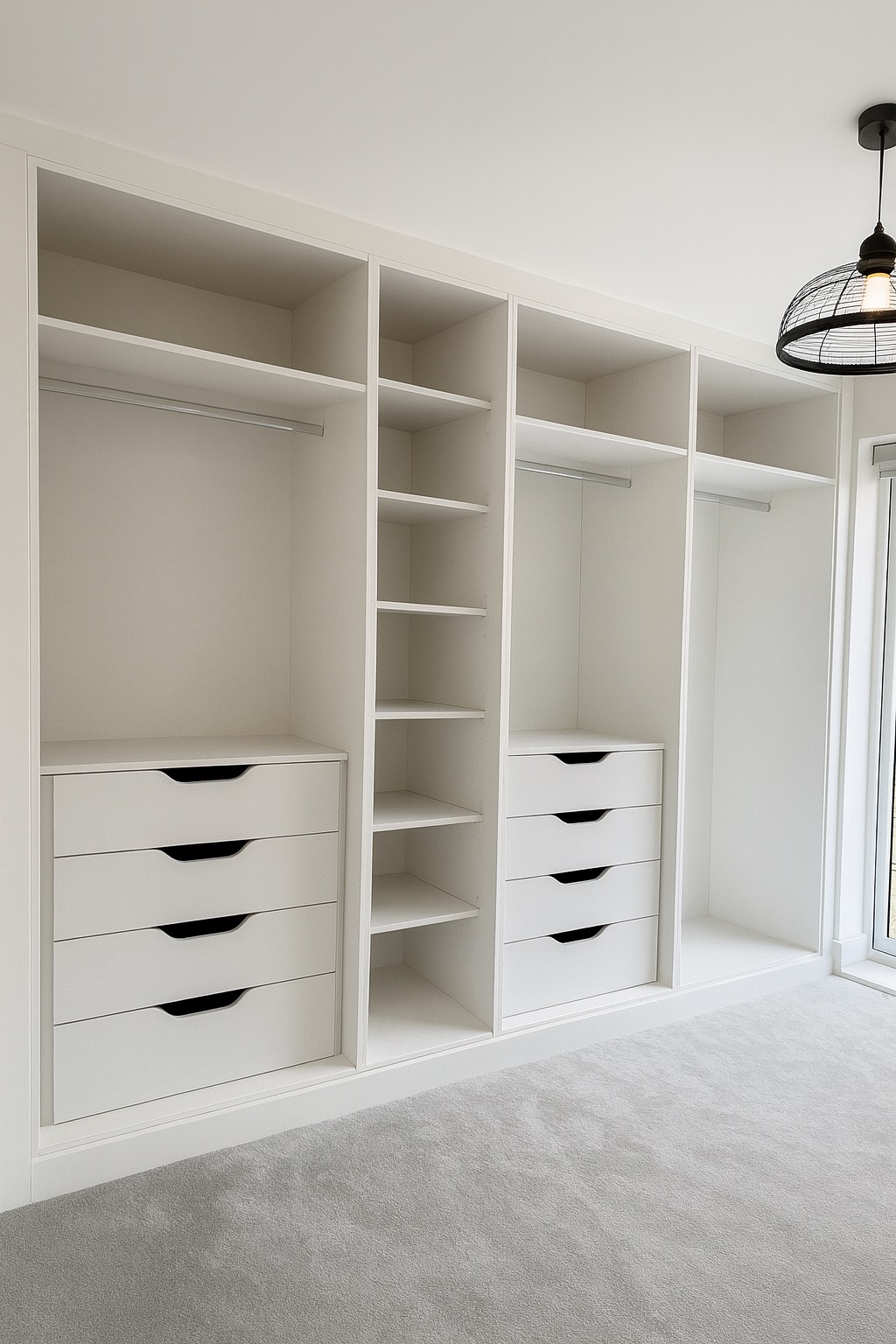 Walk-in wardrobe interior with hanging space, internal drawers and shelving by Simply Fitted Wardrobes