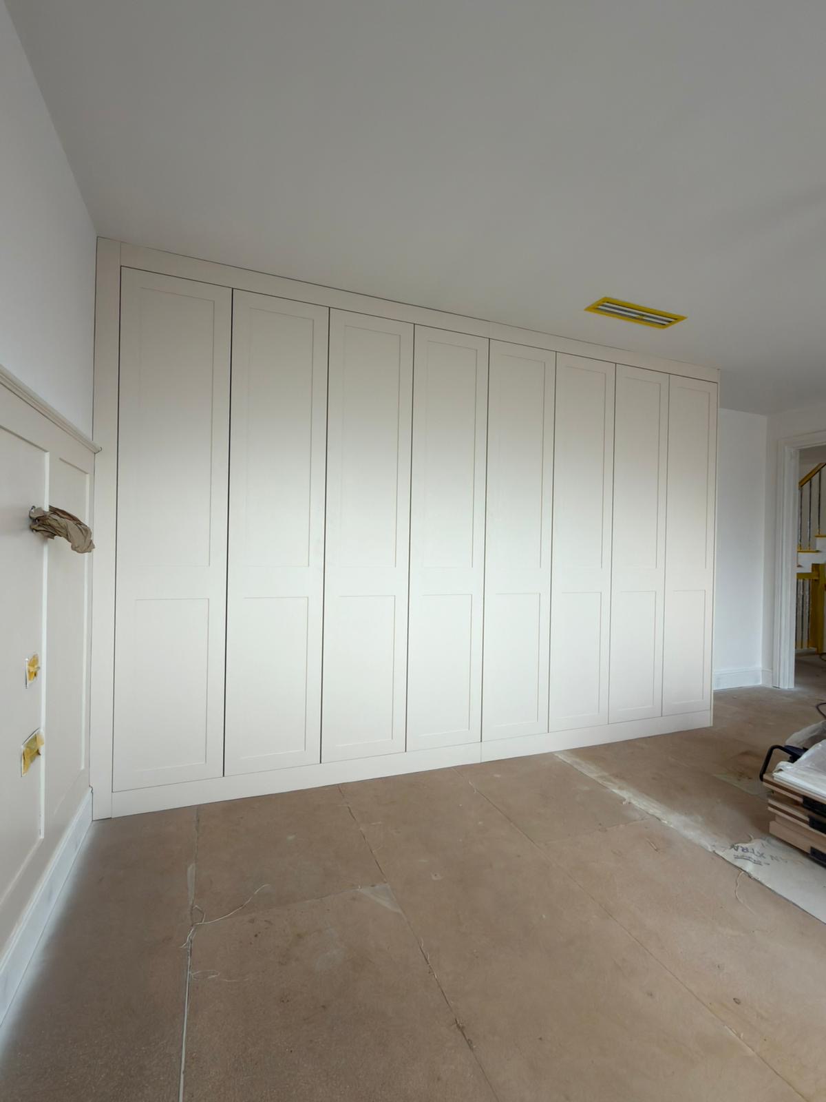 Full wall Goodwood bespoke fitted wardrobes with custom panel proportions