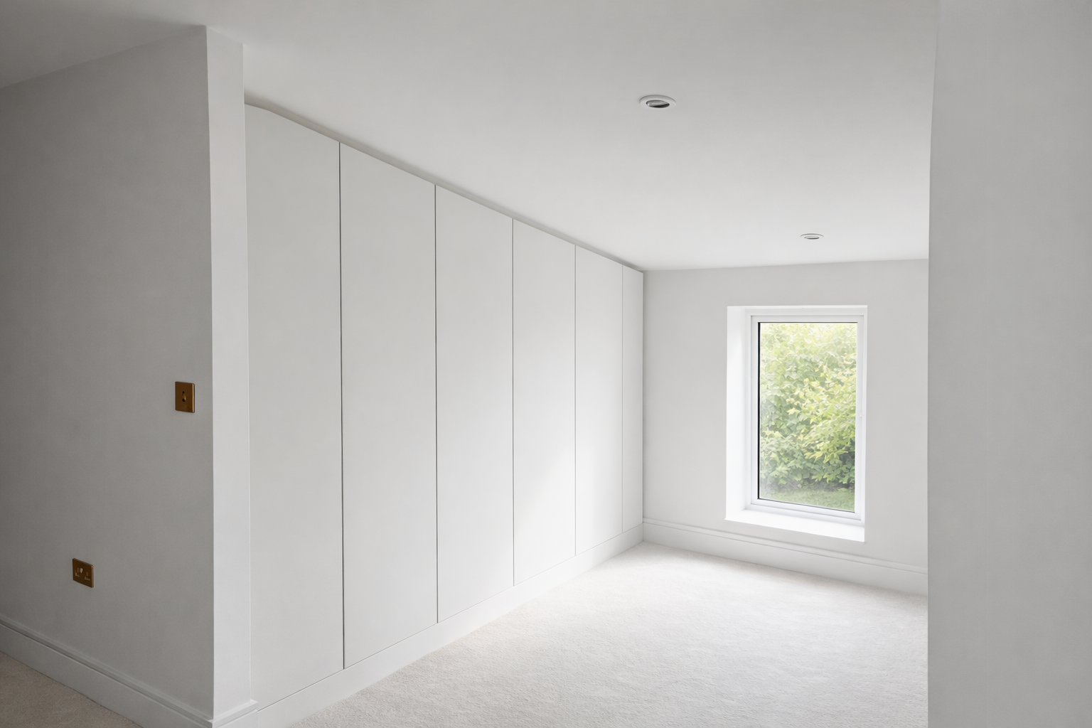 Angled walk-in wardrobe layout featured on our Hertford page